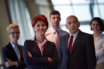 Image showing diverse business people group with redhair  woman in front