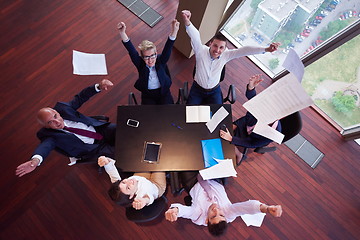 Image showing top view of business people group throwing dociments in air