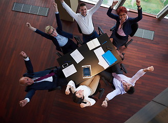 Image showing top view of business people group throwing dociments in air