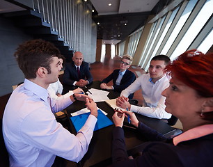 Image showing business people group on meeting at modern bright office