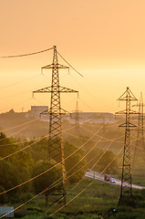 Image showing Power lines illuminated by the setting sun