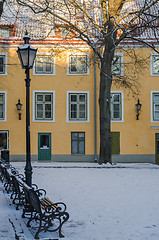 Image showing Bench and street lamp in the park winter Old Tallinn