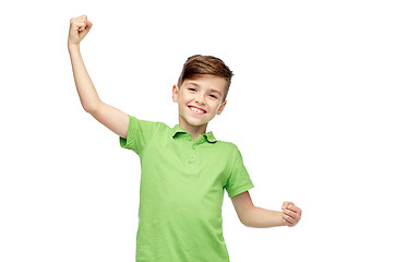 Image showing happy boy in polo t-shirt showing strong fists