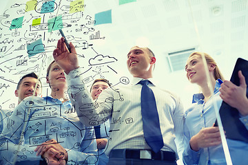 Image showing smiling business people with marker and stickers