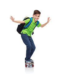 Image showing happy student boy with backpack and skateboard