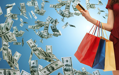 Image showing close up of woman with shopping bags and bank card