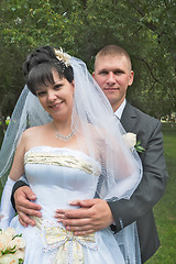 Image showing Pretty married couple posing outdoors