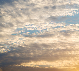 Image showing in the red blue sky cloud and sunrise orange color