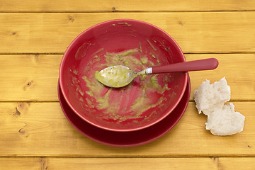 Image showing Pieces of bread next to an emptied bowl of soup