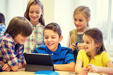 Image showing group of school kids with tablet pc in classroom