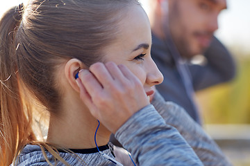 Image showing happy woman with earphones listening to music