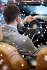 Image showing close up of man in cabrio car at auto show