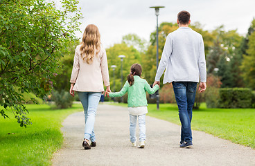 Image showing happy family walking in summer park