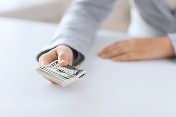 Image showing close up of woman hands holding us dollar money