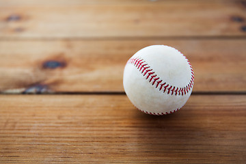 Image showing close up of baseball ball on wooden floor