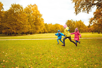 Image showing group of happy little kids running outdoors