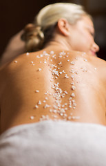Image showing close up of woman having salt massage in spa