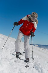 Image showing Putting on skis