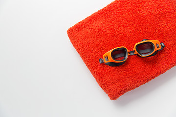 Image showing close up of swimming goggles and towel