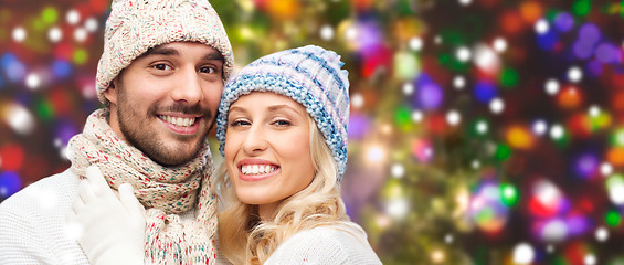 Image showing smiling couple in winter clothes hugging