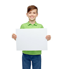 Image showing happy boy in t-shirt holding white blank board