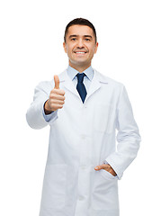 Image showing smiling doctor in white coat showing thumbs up