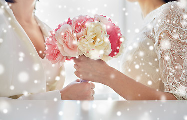 Image showing close up of happy lesbian couple with flowers