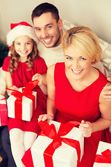 Image showing happy family opening gift boxes