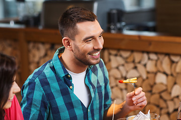 Image showing happy man having dinner at restaurant