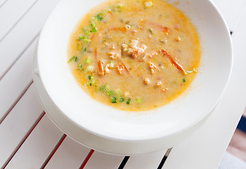 Image showing close up of cream soup plate on table