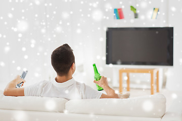 Image showing man watching tv and drinking beer at home