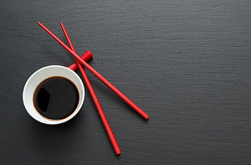 Image showing Soy sauce with chopsticks