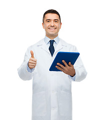 Image showing smiling male doctor in white coat with tablet pc