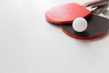 Image showing close up of table tennis rackets with ball