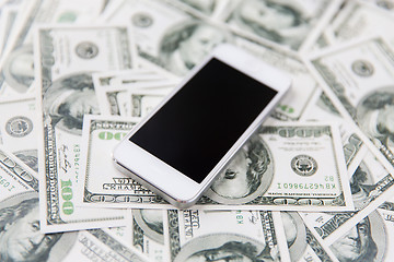 Image showing close up of smartphone and dollar money