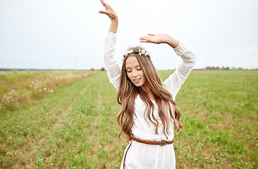 Image showing smiling young hippie woman on cereal field