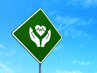 Image showing Insurance concept: Heart And Palm on road sign background