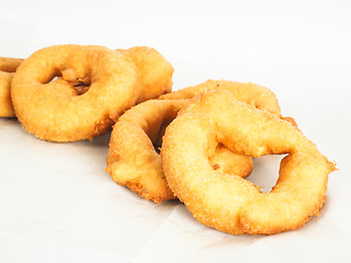 Image showing Closeup of doughnuts in pile on baking paper