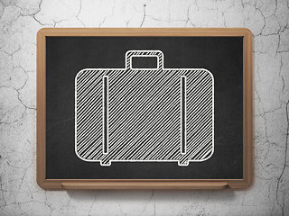 Image showing Tourism concept: Bag on chalkboard background