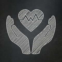 Image showing Insurance concept: Heart And Palm on chalkboard background