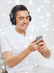 Image showing happy man with smartphone and headphones