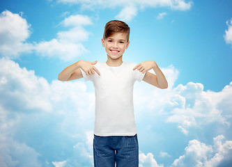 Image showing happy boy pointing finger to his white t-shirt