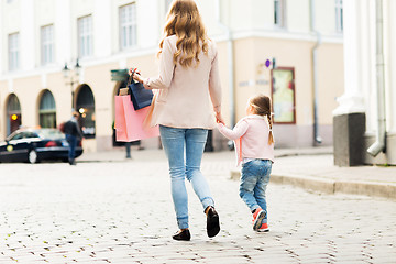 Image showing close up of mother and child shopping in city