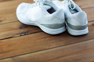 Image showing close up of sneakers on wooden floor