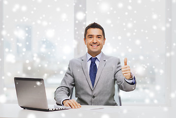 Image showing businessman working with laptop in office