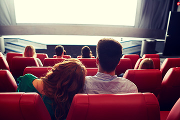 Image showing happy couple watching movie in theater or cinema