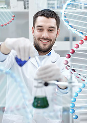 Image showing scientist with test tubes making research in lab