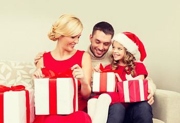 Image showing happy family opening gift boxes