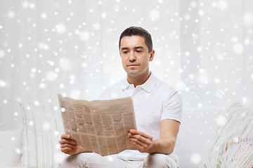 Image showing man reading newspaper at home