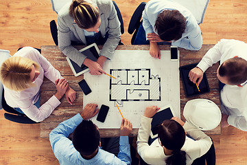 Image showing close up of business team sitting at table